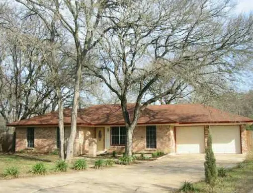a house with a tree in front of it