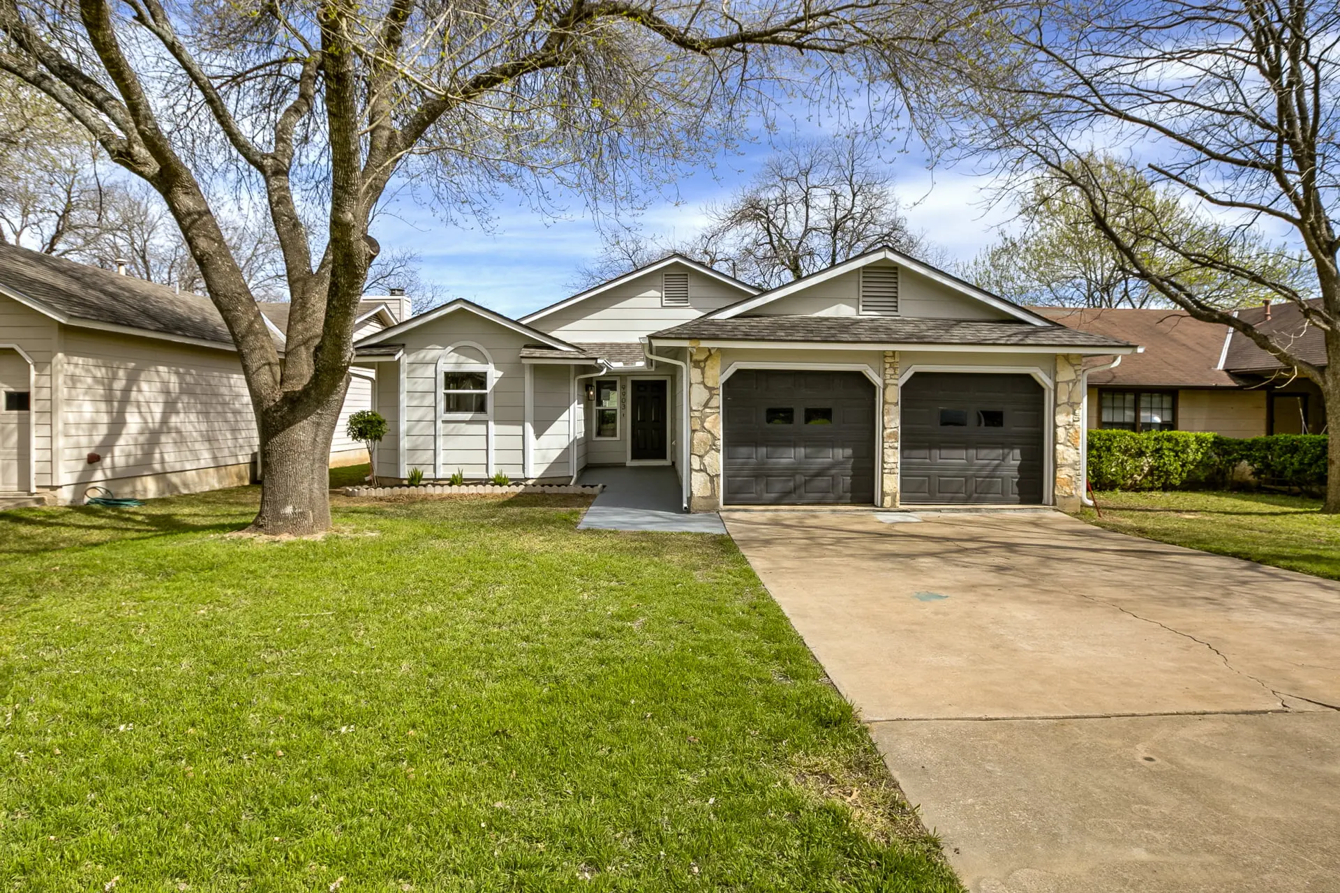 a house with a driveway in front of it