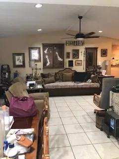 a living room filled with furniture and a flat screen tv