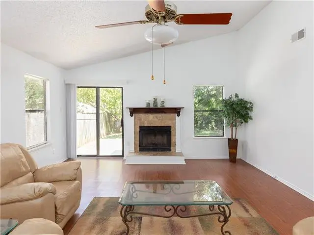 a living room filled with furniture and a fire place