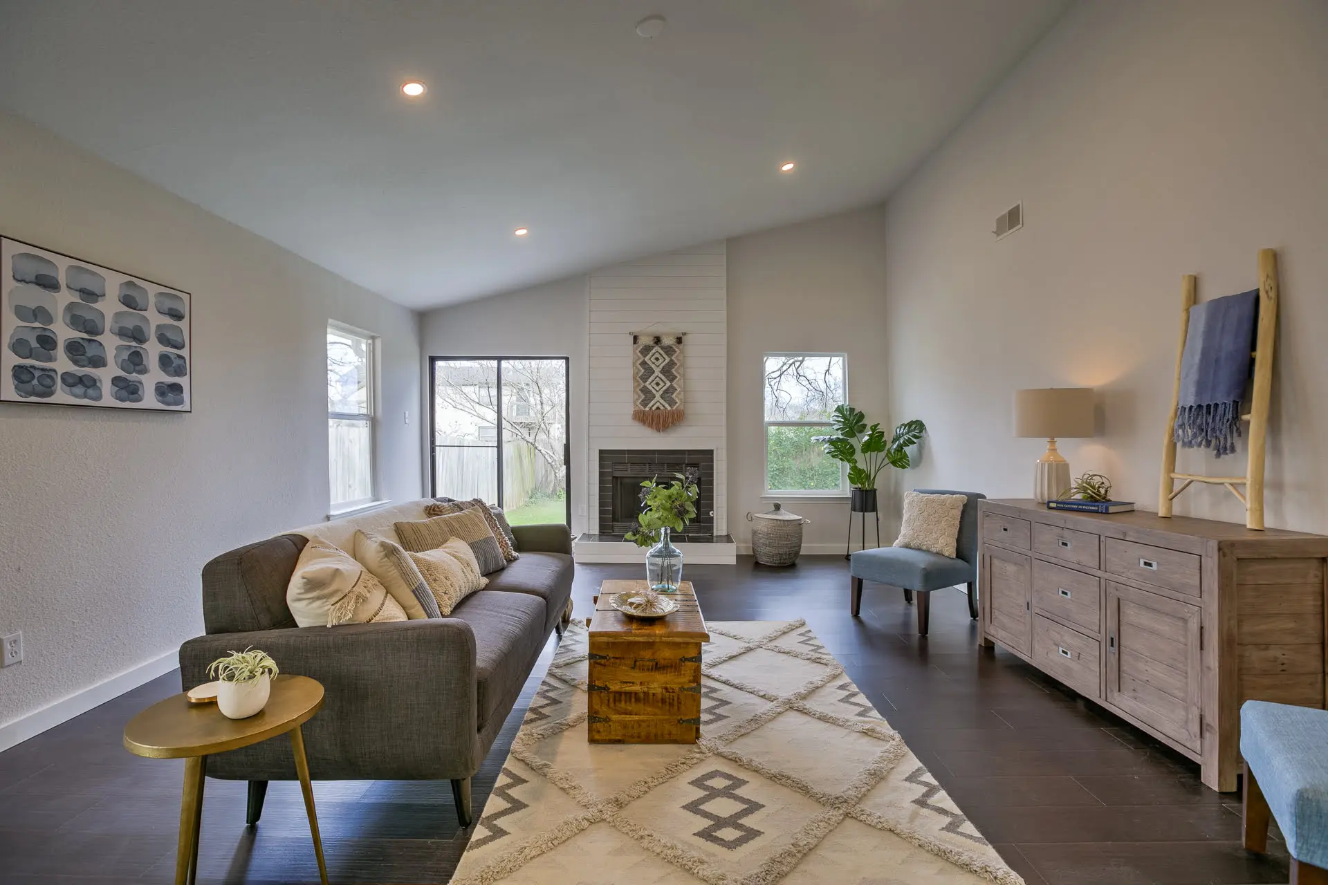 a living room filled with furniture and a fire place
