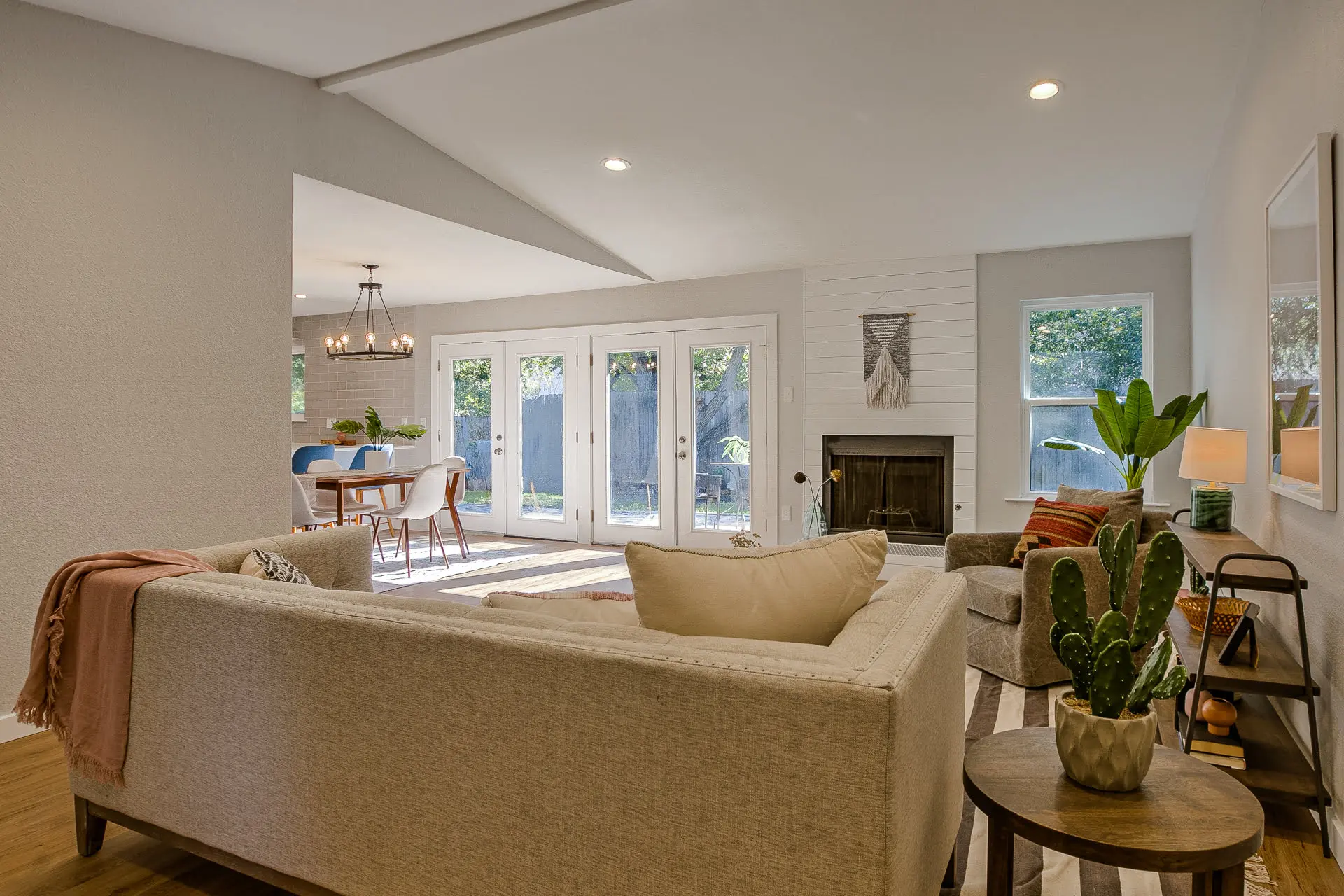 a living room filled with furniture and a fire place