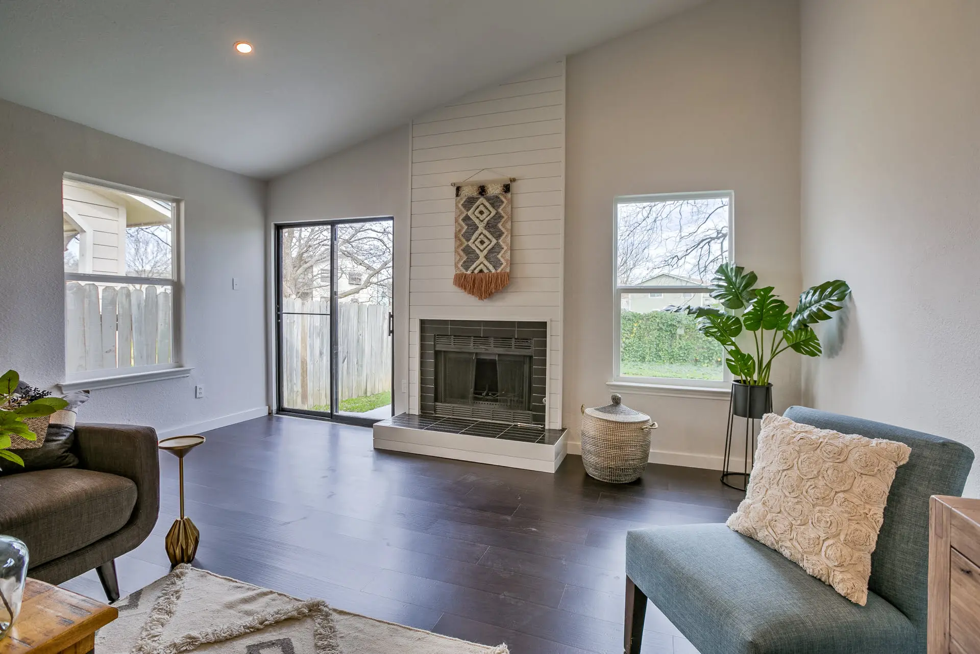 a living room filled with furniture and a fire place