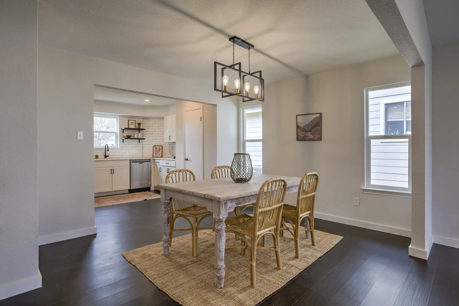 a dining room with a table and chairs