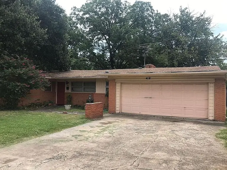 a house with a driveway in front of it