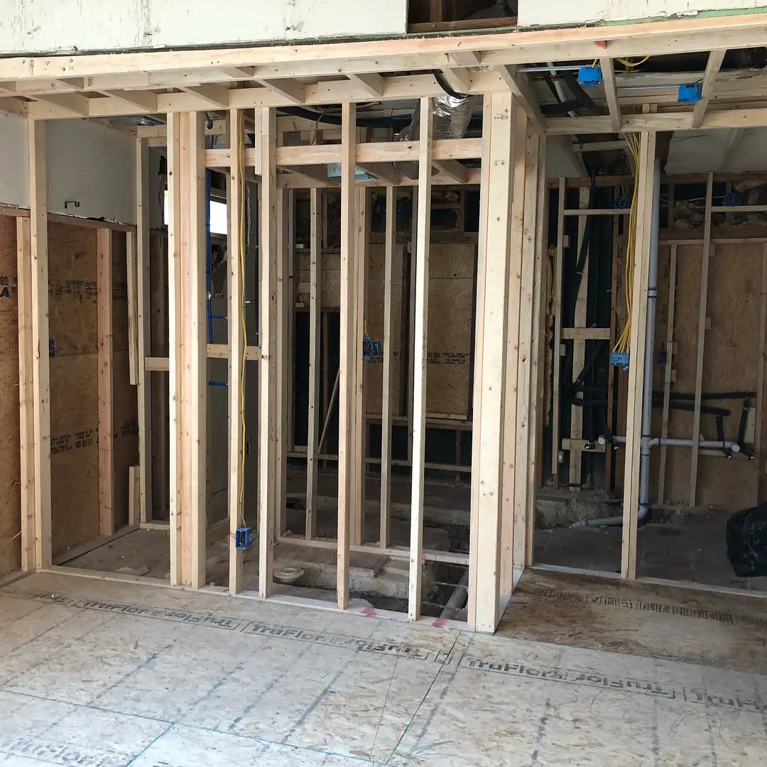 a room that is under construction with wooden framing