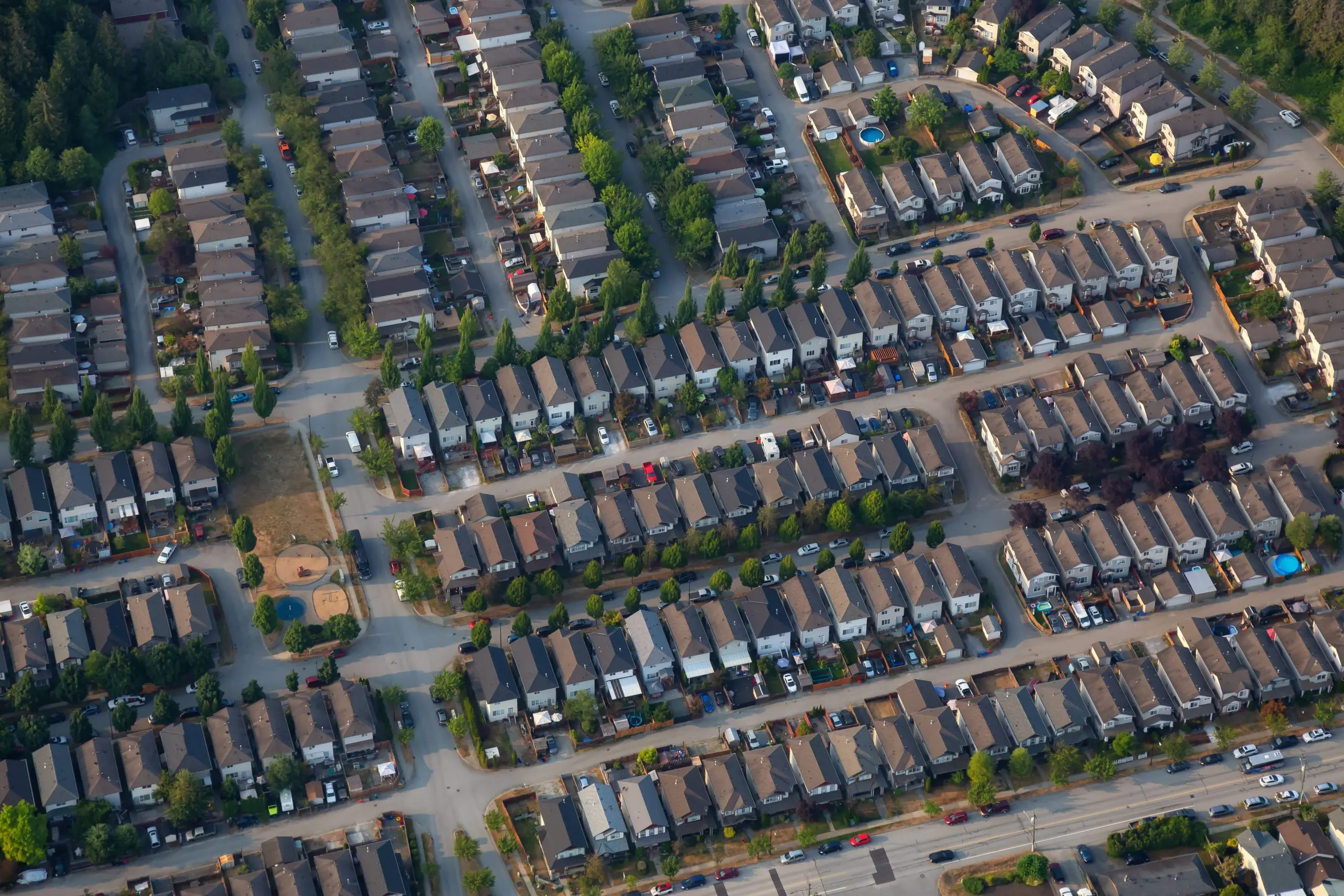 https://www.newwestern.com/wp-content/uploads/2023/05/aerial-view-of-residential-neighborhood-during-a-s-2022-03-30-00-24-53-utc-scaled.jpg