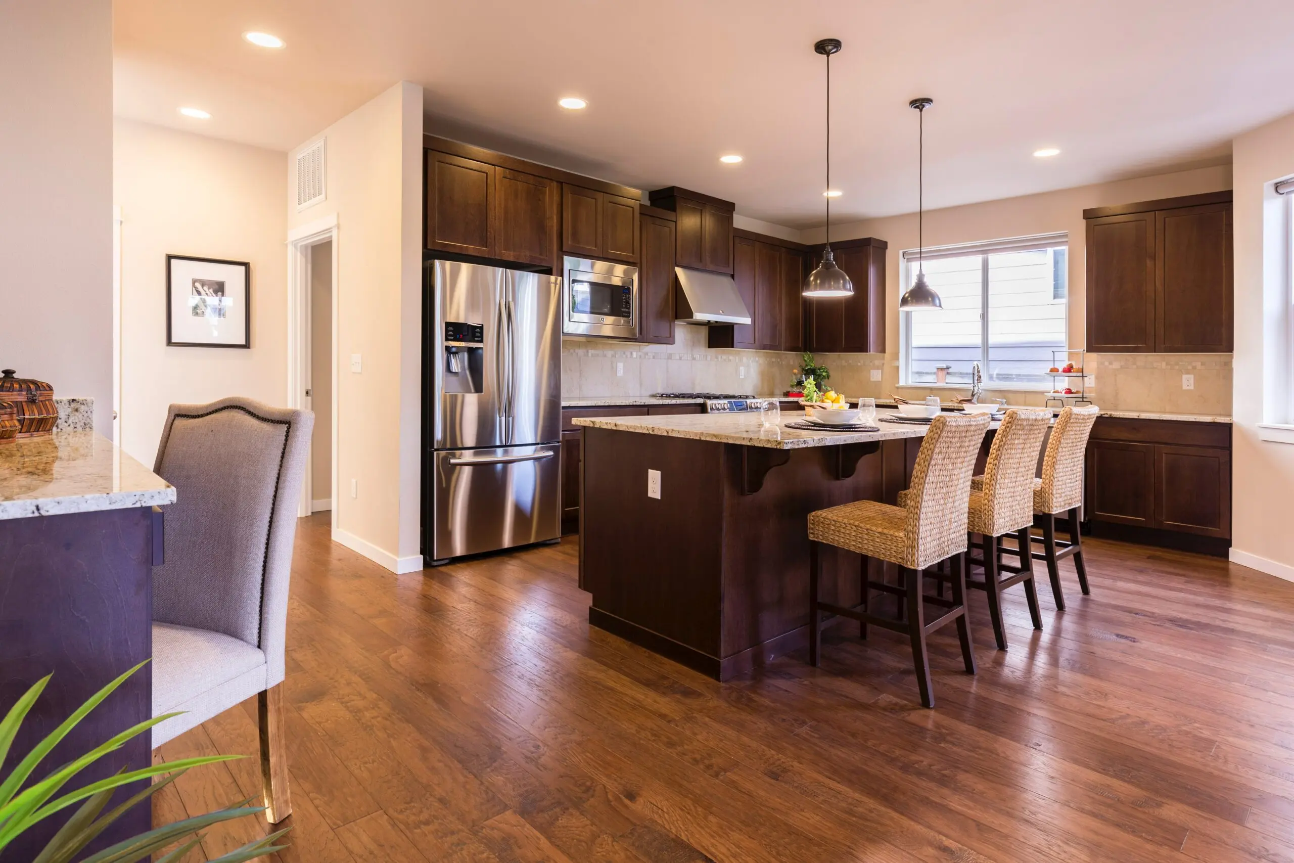 a kitchen with stainless steel appliances and wooden cabinets