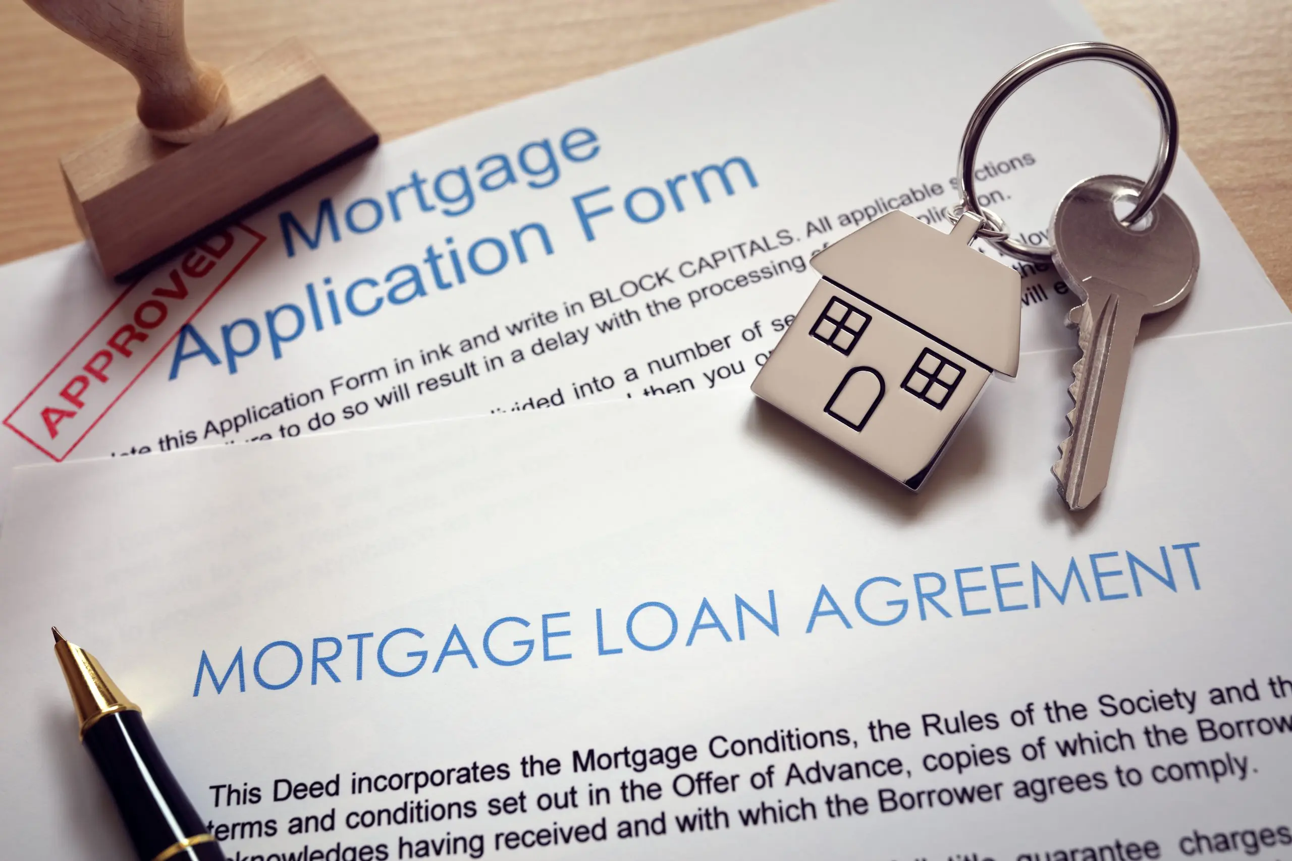 https://www.newwestern.com/wp-content/uploads/2023/05/mortgage-application-loan-agreement-and-house-key-2022-02-02-05-05-24-utc-scaled.jpg