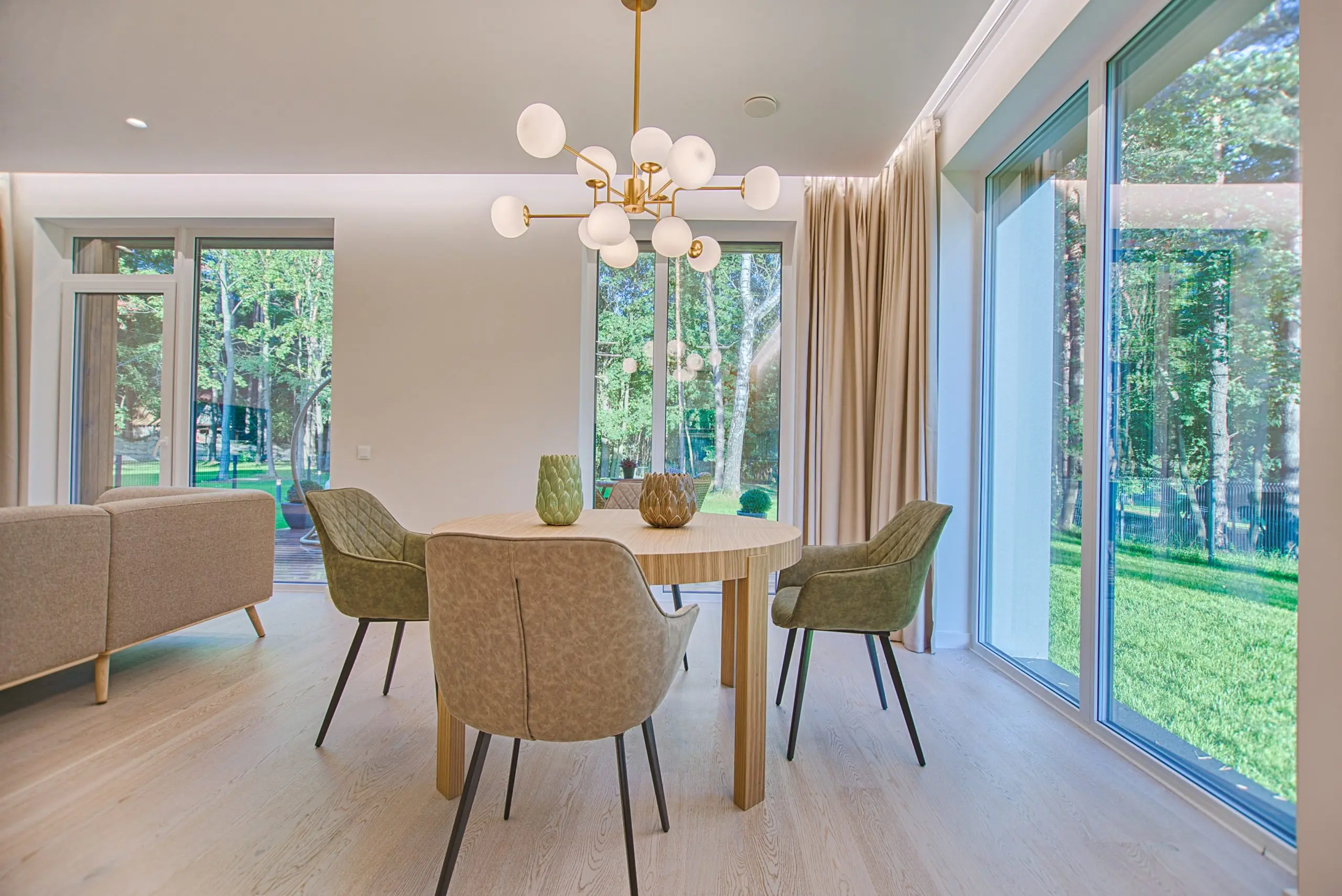 a dining room with a table and chairs and a chandelier