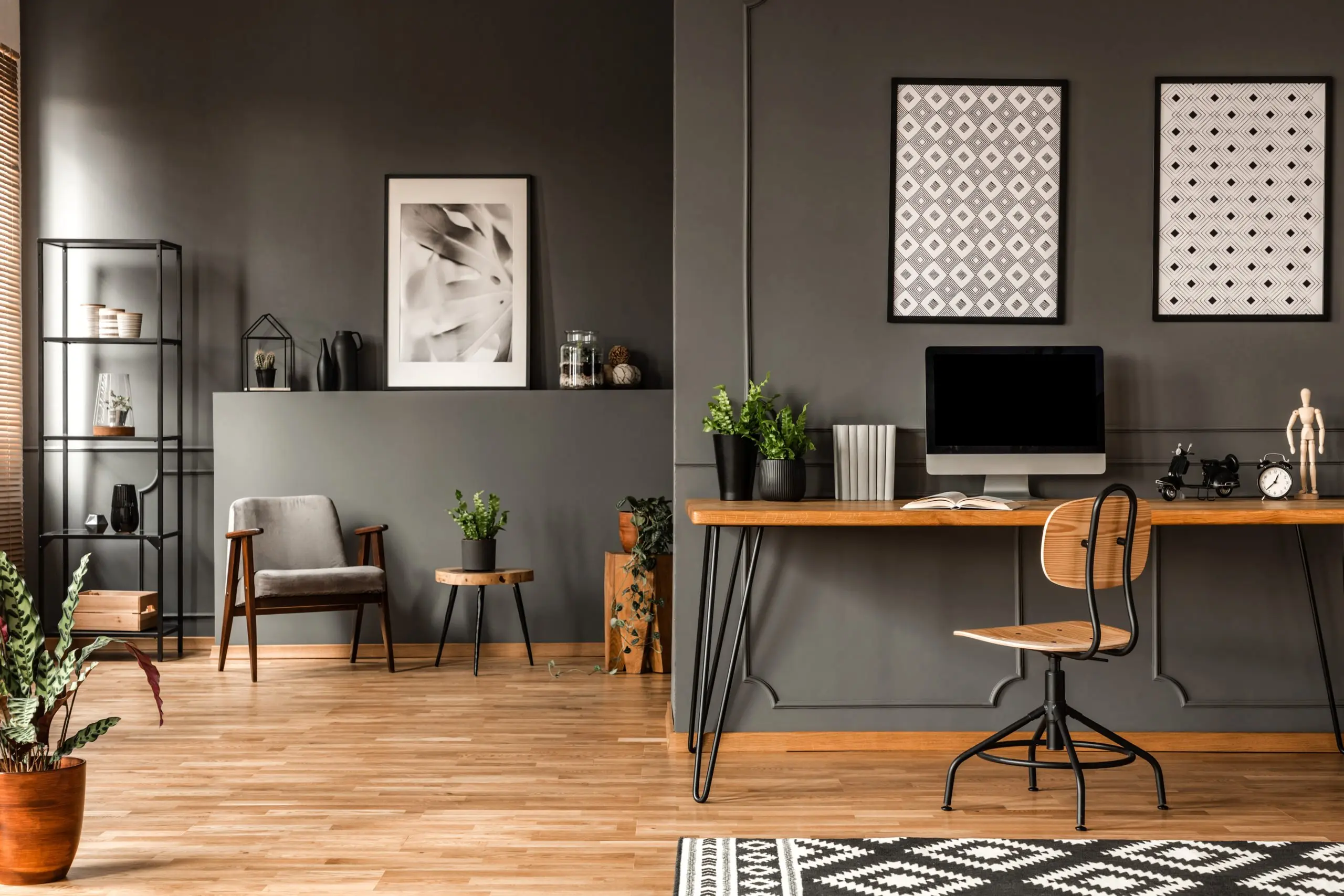 a desk with a computer on it in a room