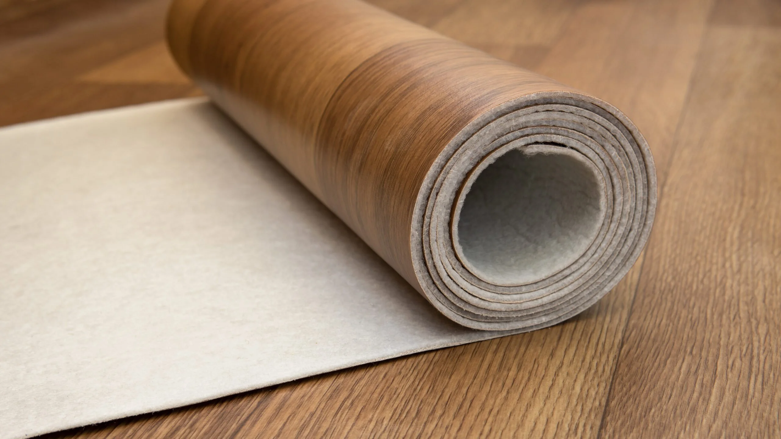 a roll of vinyl flooring that looks like wood