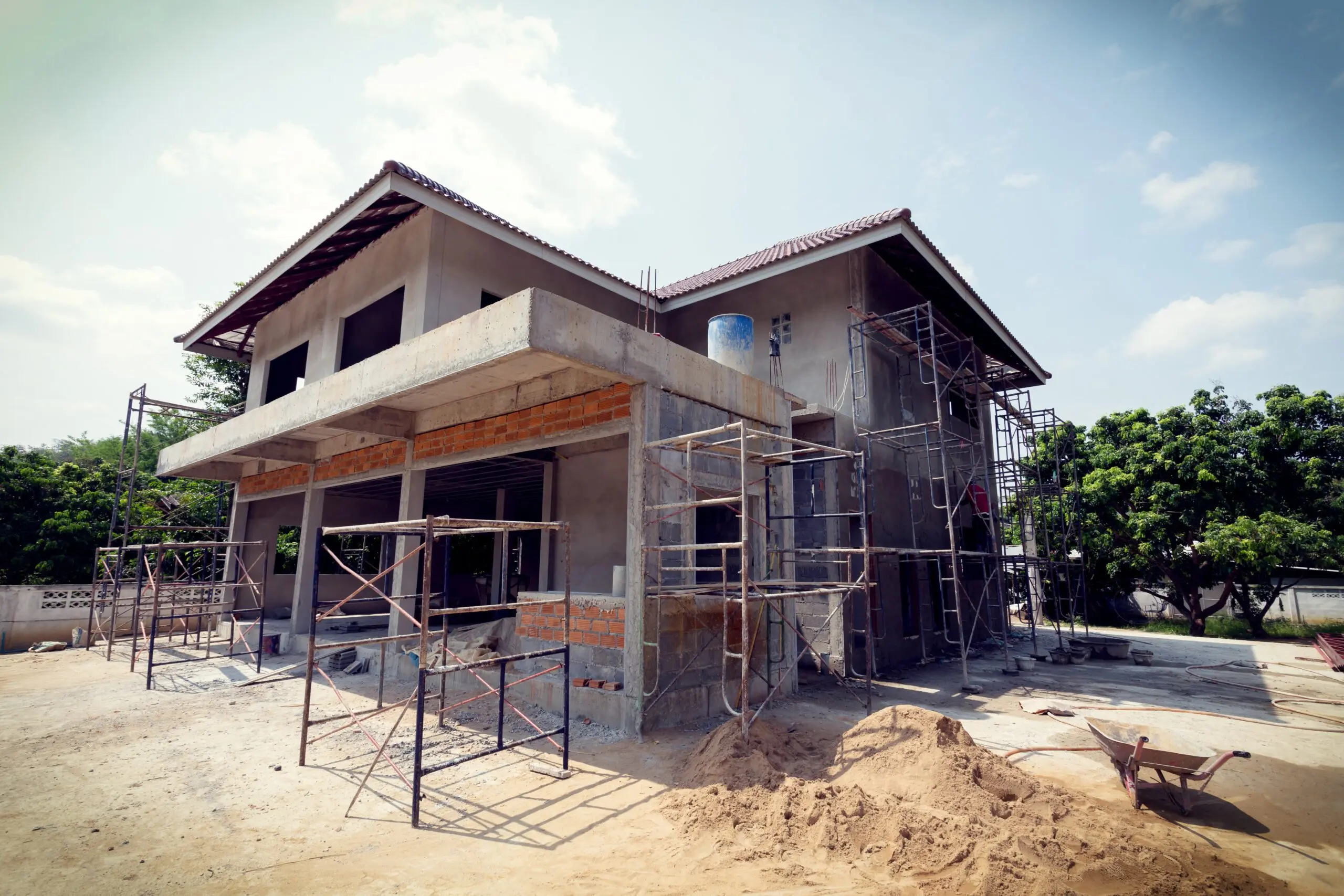 a house that is being built with scaffolding around it