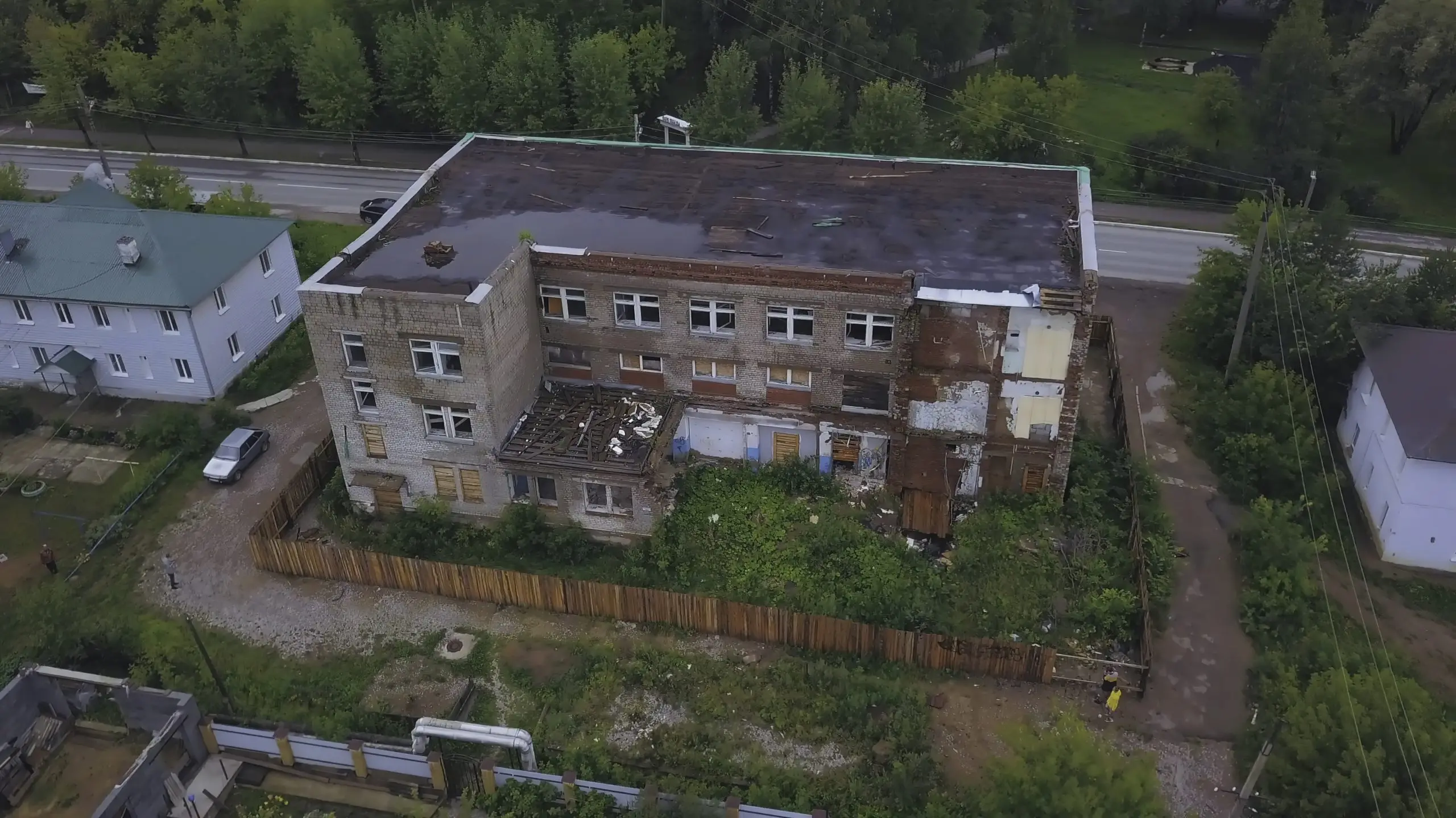 https://www.newwestern.com/wp-content/uploads/2024/01/top-view-of-abandoned-brick-building-in-residentia-2023-11-28-01-16-44-utc-scaled.jpg