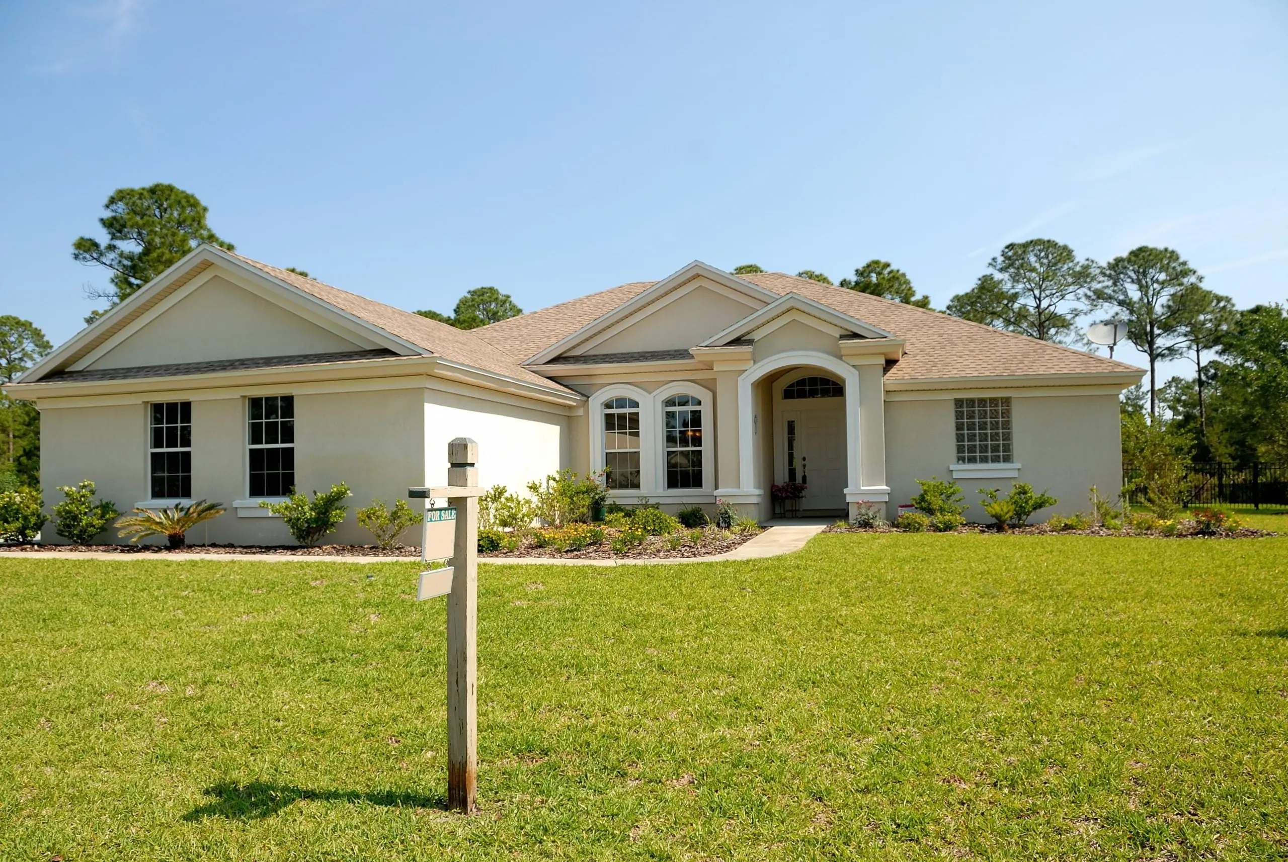 https://www.newwestern.com/wp-content/uploads/2023/01/white-and-brown-concrete-bungalow-under-clear-blue-sky-210617-1-scaled-1.jpg