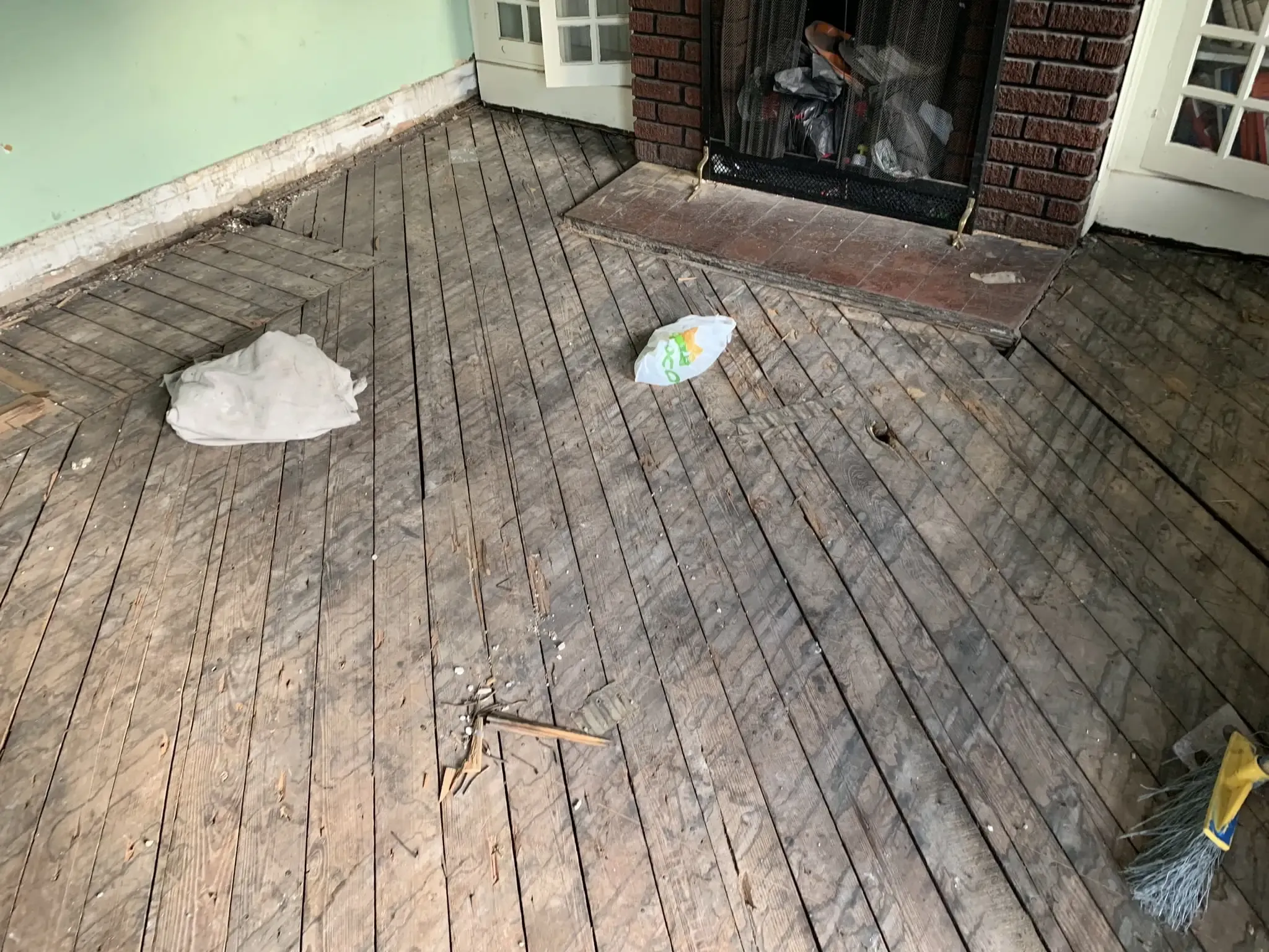 a wooden deck with a fire place in the middle of it